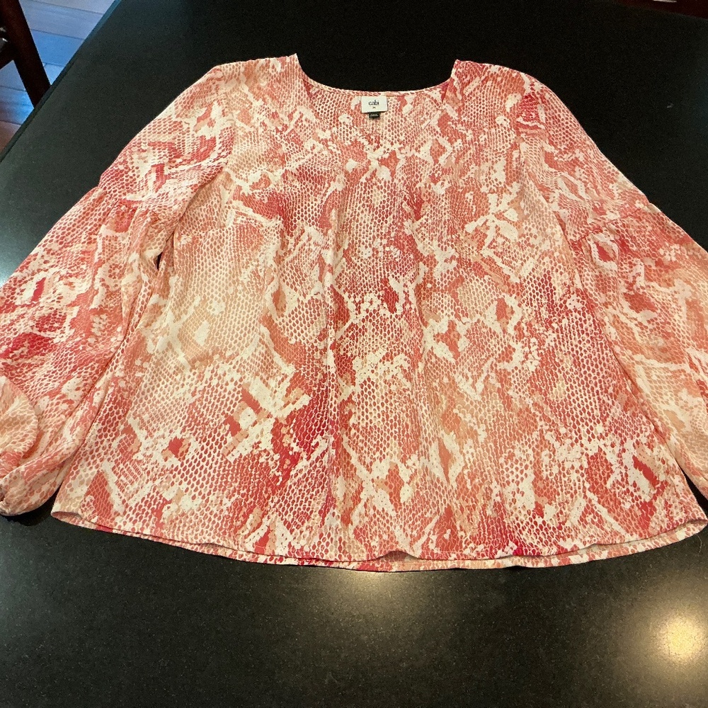 Long sleeve blouse made by Cabi, size medium. Pink, white and tan snake print.